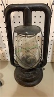 Antique Dietz railroad lantern with a clear