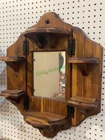 Vintage cedar wood shelf unit with a mirror in the