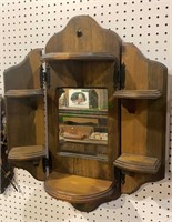 Vintage pine wood shelf unit with a mirror in the