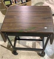 Small drop leaf worktable with covered wheels
