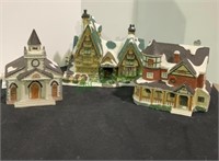 Set of three ceramic Christmas village houses.