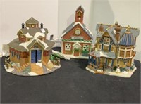 Set of three Christmas village houses in ceramic.