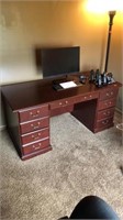 9-drawer cherry colored desk