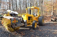 John Deere 301-A broom tractor