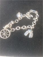 Small silver tone charm style bracelet maybe for
