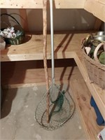 Fishing net and walking stick