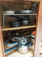 Cupboard full of pots and pans