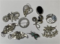 COLLECTION OF STERLING SILVER BROOCHES