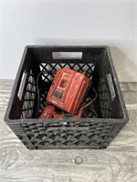 Two Hilti Battery Tools and a Charger in a Milk