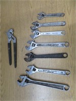 SHELF OF 7 CRESCENTWRENCHES & 1 ADJUSTABLE WRENCH