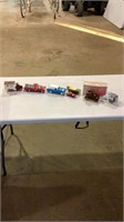 Assorted toy cars, wix filters, 1906 reo depot