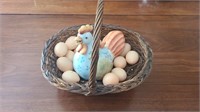 Hen in a basket of eggs