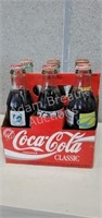8 assorted Coca-Cola commemorative bottles- Super