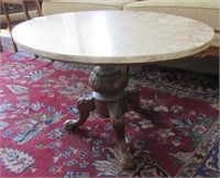 An Oval Marble Top Coffee Table