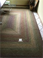 Area rug . Approximately 10’ x 7’ 9 ‘