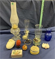 Assorted trinkets, vases and kerosene lamp