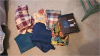 Lot of table cloths and 1 bedskirt