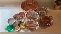 Lot of copper color metal pans and coasters
