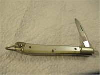 White Handle Knife Has Ring