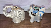 2 elephant figurines 1 made in Uruguay  4” long
