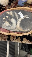 Painted dog stone in basket
