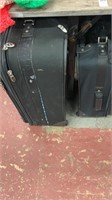 3 suitcases 2 black 1 burgundy