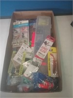 Flat of new fishing lures and supplies