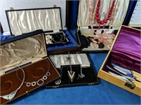 Large Assortment of costume jewellery and cases,