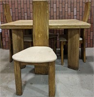 Very unique heavy wooden table and 4 chairs. 1