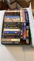 Box of VHS tapes as shown, mostly music related