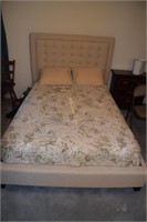 Full size bed with mattress and padded headboard