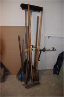 Lot of yard tools to include rakes, shovel, edger