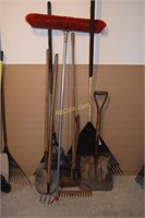 Lot of yard tools- shovels, rakes, and axe