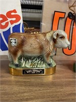 Ezra Brooks bull decanter and decorated with 24