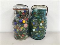 Two Clear Mason Jars Filled With Marbles
