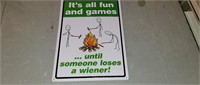It's all fun and games sign tin