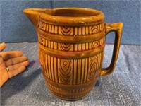 Old brown stoneware barrel pitcher