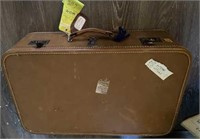 LEATHER SUITCASE WITH MISCELLANEOUS DOLLS