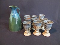 An Art Pottery Pitcher and Cups