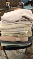 Stack of towels with hamper