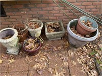 assorted planters and concrete planter