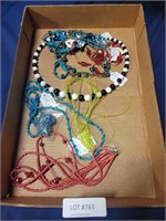 FLAT BOX OF BEADED COSTUME JEWELRY NECKLACES
