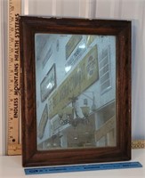Very old oak mirror with worn silvering