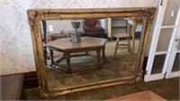 Large gilt framed beveled mirror 48” x 36”
