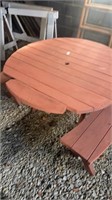 Round wooden picnic table with 2 benches