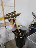 GROUP OF VARIOUS BROOMS AND DUST PANS