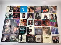 Assorted 45 Records With Sleeves