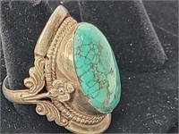 Ring  w/ Turquoise stone?  Size 12 Silver?