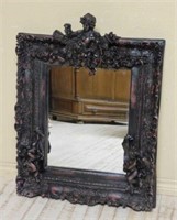 Putti and Torch Accented Wall Mirror.