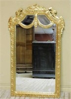 Floral Accented Gilt Beveled Mirror.